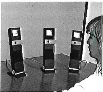 Figure 2.2, the Hydra system in use showing three video surrogates (from [SeI92]). 
