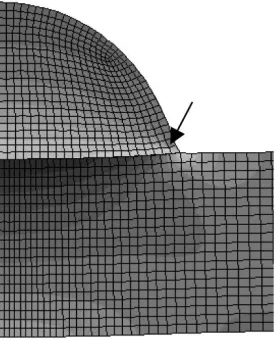 Fig. 18.Finite element mesh of a portion of the glass-silicon structure. Thearrow indicates the location of maximum tensile stresses in the glass.