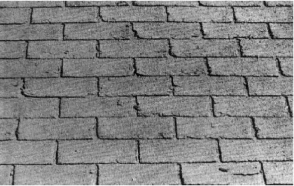 Figure 27.  Recoated asphalt shingles — note damage resulting from brittleness.