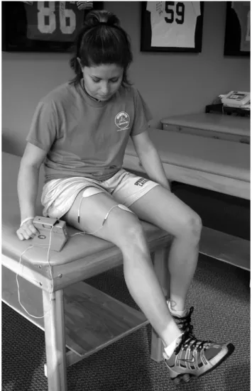 FIGURE 5. Neuromuscular electrical stimulation (300PV; Empi, Corporation, St Paul, MN) applied to the quadriceps muscle during exercises such as knee extension.