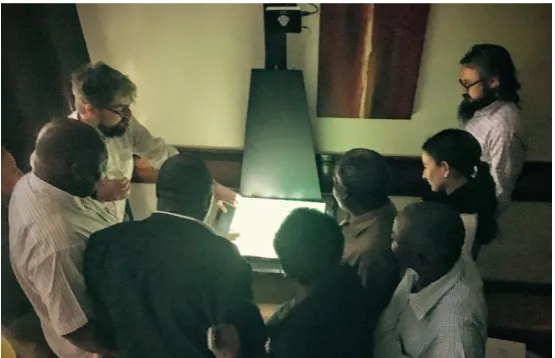 Figure 5 . Use of a mobile PARM installation to aid Dar es Salaam city council and World Bank members in discussions of population mobility patterns in Tanzania