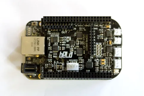 Figure 1. Bela, which consists of a custom hardware board (“cape”) ona BeagleBone Black running specialised software.