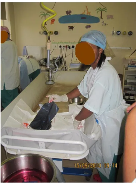 Figure 1 A bath bed with a mobile shower head is used for most dressing changes at the Red cross children’s hospital in cape Town, south Africa.