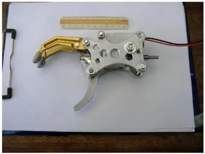 Figure 1 Mechanical structure of the prosthetic hand.Note: A 10 cm ruler is shown as a reference.
