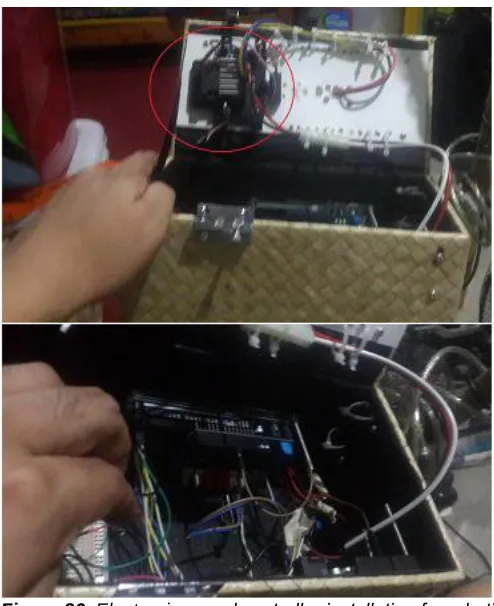 Figure 25 . Installation of robotic arm and counterweights (or hinges) to the robotic arm held on December 8, 2017