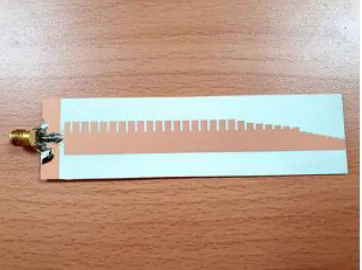 Fig. 6 . a) Small RF/microwave PCB with coplanar waveguide, and b) Large and software RF/microwave PCB with a number of coplanar waveguides