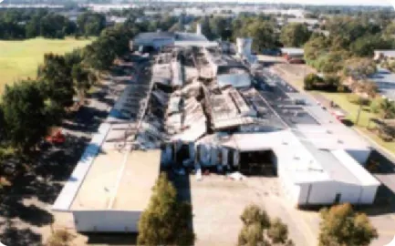 FIGURE 4 - AERIAL VIEW OF THE FIRE DAMAGE TO        THE TIP TOP BAKERY