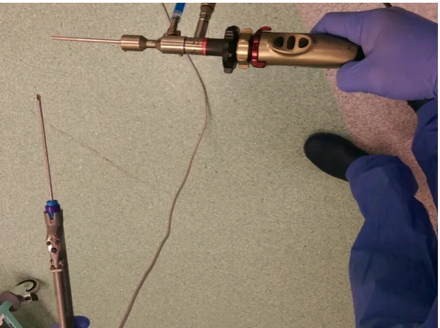 Figure 3a: (above) Shoulder scope (on a plastic shoulder model) hand position showing the 