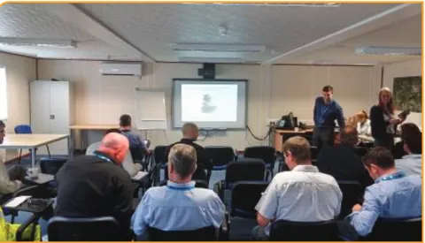 Fig. 2. Research team presenting the VM implementation options to project 2 management