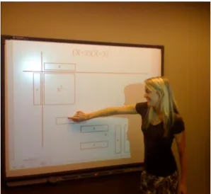 Figure 10. Ms. Kilgore implementing SMARTboard technology in  factoring polynomials. 