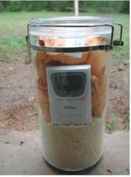 Figure 9.  Dried rice inside a sealed  container with seed packets and  a wireless hygrometer (to monitor  relative humidity; optional)