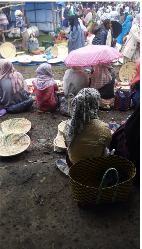 Figure 1. Photo of women Selling fruits and other local produced products at the local market, Gulit (April, 2019) 