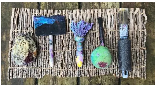 Figure 2. A sample of Miles Scharfenberg’s adapted tools and paint brushes. 
