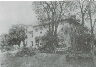 Figure 1. showing a Schuyler Mansion after 1905 showing the addition built for the orphans on the back of the building and group of orphans posed near the southeast comer of the house