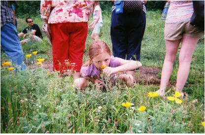 Figure  10:  A  child  smells  the  flowers  at  Zydeco  Moon  Farm.  Photo  by  visitor