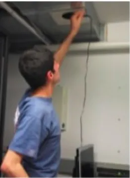 Figure 7: Student taking airflow readings in server room 