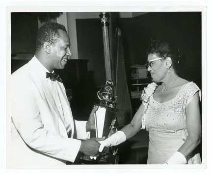Figure 2. This photograph captured Camille Nickerson receiving an award for her lifetime of achievements at the National Conference of the National Association of Negro Musicians, Inc