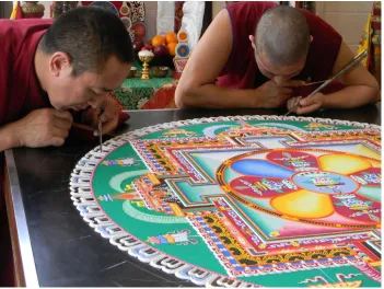 Figure 2. Buddhist monks working on a sand mandala.  