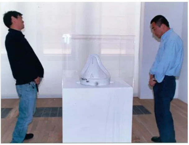 Figure 10. Cai Yuan and Jian Jun Xi, Two Artists Piss on Duchamp’s Urinal, 2000, performance  