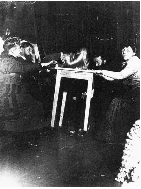Figure 1: A photograph of table-tipping. Taken 1898 with medium Eusapia Palladino. 