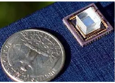 Figure 2-5: A compact OFM compared with a US quarter. The OFM consists of a CMOM camera, a thin metallic film with nanoaperture patterns and a microfluidic chip (by courtesy of Xiquan Cui)