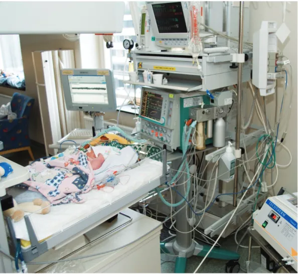 Figure 1: A newborn baby is treated after asphyxia during birth. The bed is cooled  with circulating water to reduce further damage to the brain, and various parameters,  e.g