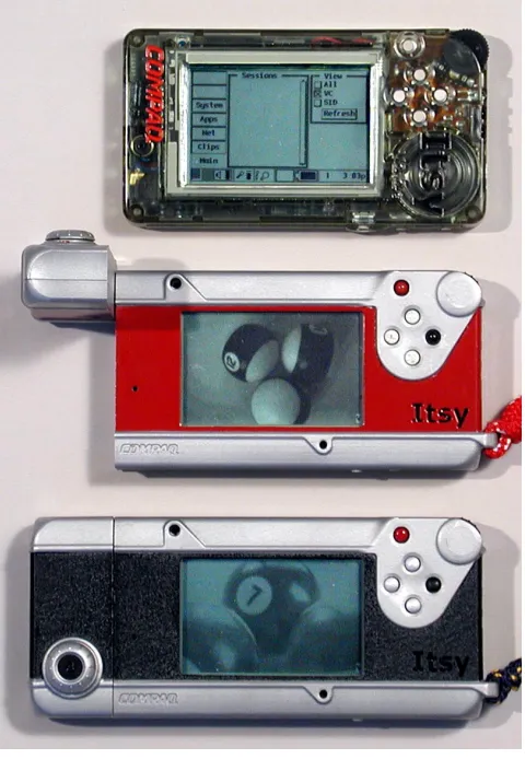 Figure 1: Three Itsy Pocket Computers.  At the top of the picture is an unmodified Itsy