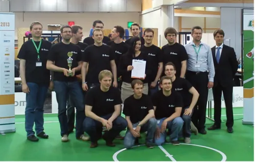 Fig. 1: The team B-Human at the RoboCup German Open 2013 award ceremony.