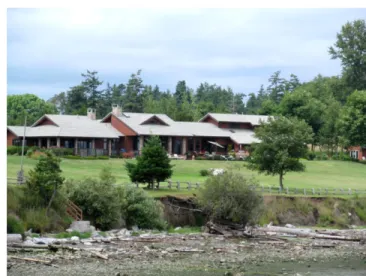 Figure 15-10:  This home is located on a shoreline with an  eroding bank. The home is not in any danger; stabilization  would not be allowed