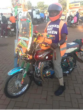 Figure 3. A SafeBoda in his “pimped out ride” in Kampala (Juliet Kategaya Nsiima). 