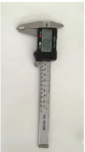 Figure 1. Thickness measurement of specimens by a digital caliper. 