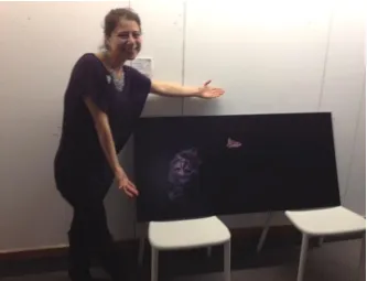 Figure 2.8: Photo of me explaining and validating my work to someone at the show 