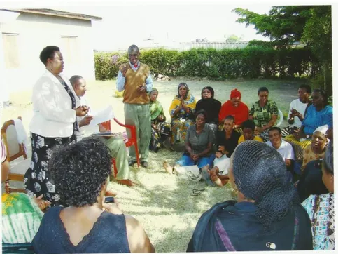 Figure  2: The  MCED  Student  Tabu  Milonge  being  introduced  to  Sombetini  VICOBA Members by WEO Mr