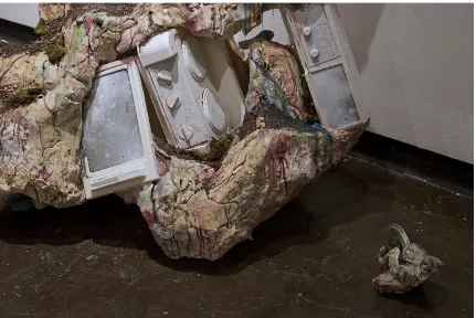 Figure 2. Ashley Maxwell.  Example of trigger object.  Childs play kitchen and real pots embedded in landscape
