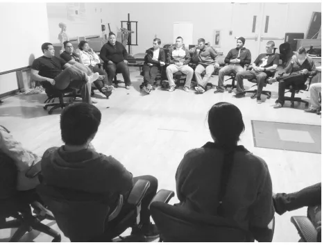 Figure 2. Students engaged in peer-review formative assessment of oral communication following group presentations during laboratory session