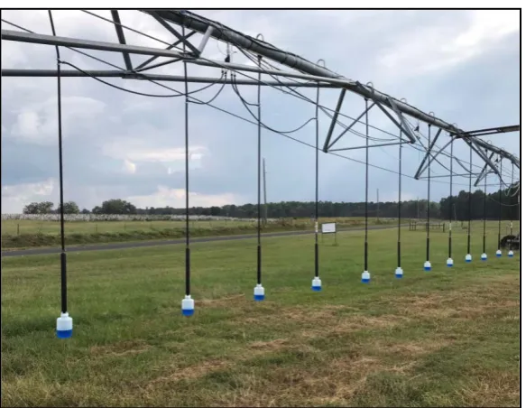 Figure 8. Uniformity test sample collection using 3-L bottles attached to the LEPA drop nozzles