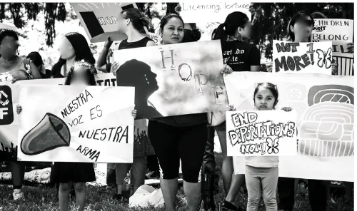 Figure 3.4. María holds “Hope” poster at #ShutDownBerks protest in Summer 2015. In this figure María (center) and her daughter (right) hold the posters made intergenerationally at Juntos workshop with local artist Michelle Angela Ortiz
