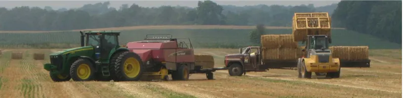 Figure 1. The large square baler, bale handler, and bale truck used in straw harvesting