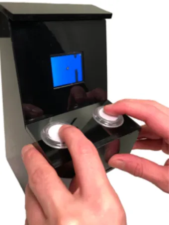 Figure 1. An example of a completed MakerArcade system in the form of a miniature Arcade Cabinet running a user-created Flappy-bird like game with a default set of buttons mapped