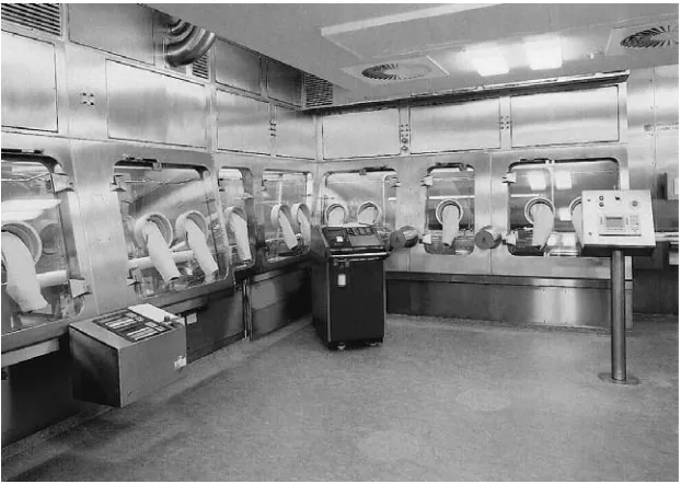 Figure 13(See Colour Plate 37). Isolator, Class 100, for filling, transportation and loading of vials into the freeze-drying plant.Decontamination of the isolator and the equiment therein is accomplished by vaporized hydrogen peroxide (VHP)