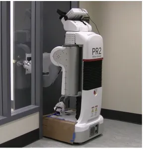 Figure 5.1: The PR2 pushing open a spring-loaded door. Once the base is in contact with