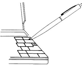 Figure 4 Pressing the Reset Button 