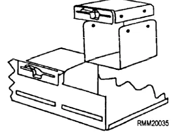 Figure 1-20.—A floppy disk drive being removed from systemunit.