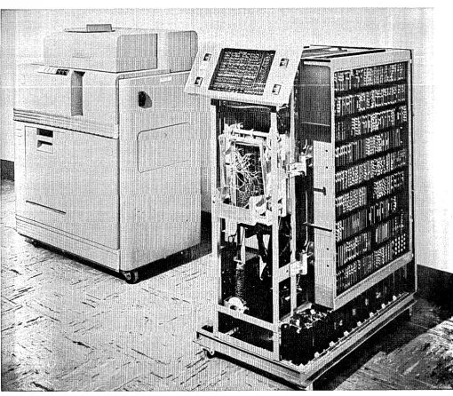 Figure 1. IBM's new experimental transistorized computer is composed of a high-speed punching unit, left, and the transistorized calculating unit at right