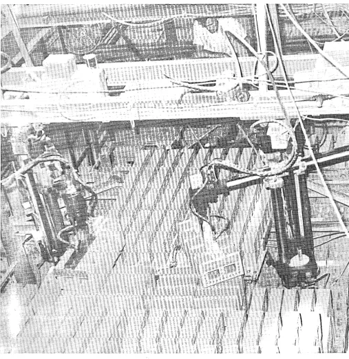 Figure 2 hands can carry three rows of eight brick at one time. Changing to different size brick involves only the changing of the robots 