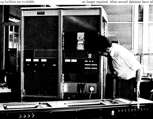 Figure 3 - TXE4 Southgate, England. The switching exchange printed boards being checked out using PROTEST language to control the test routines at STC's factory, New PROTEST tape can be seen in the top right hand corner of the tester