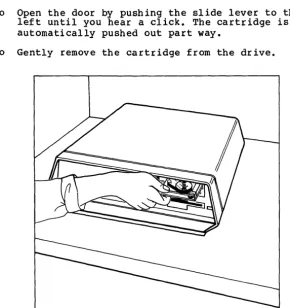 Figure 8. Inserting and Removing a Tape Cartridge 