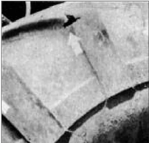 Fig. 12. A machine obstruction takes a bite out of this tire tread at each revolution.