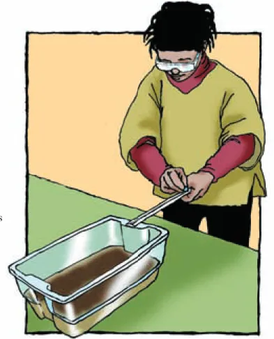 Figure 15.1 Roll the marble down the ruler into the plastic box.