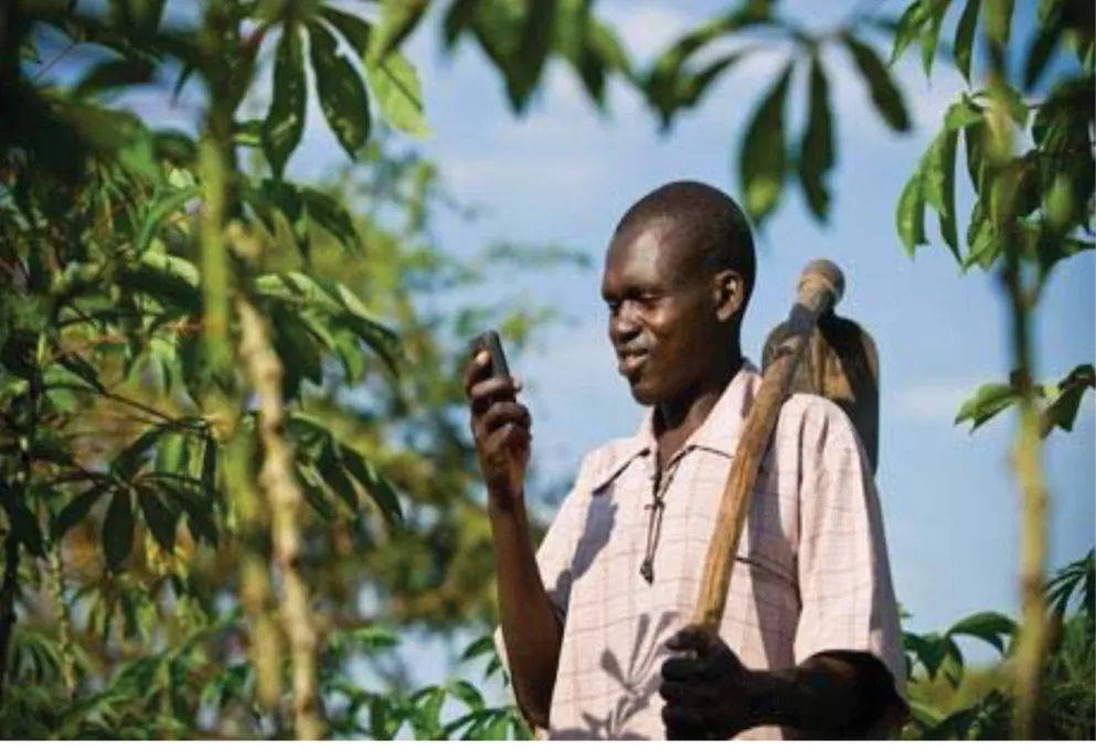 Figure 1: A happy farmer using his mobile phone.  